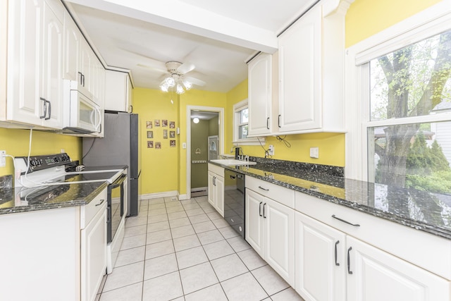 885 Hawthorne Ave, Ypsilanti, MI 48198 - kitchen featuring range with electric stovetop, white microwave, dishwasher, a sink, and white cabinets