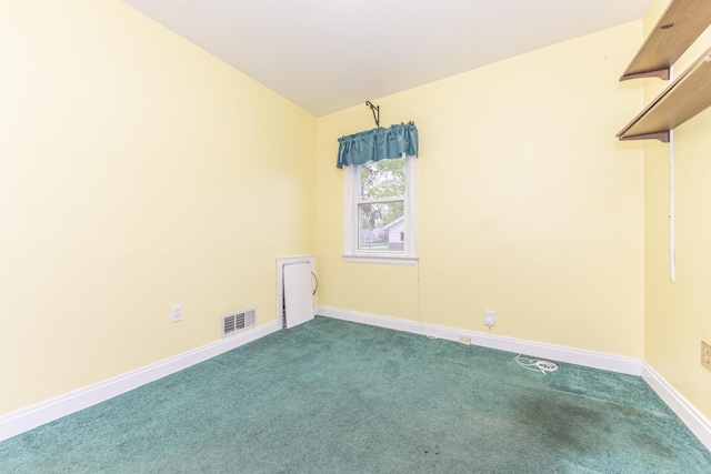 885 Hawthorne Ave, Ypsilanti, MI 48198 - carpeted spare room with baseboards and vaulted ceiling