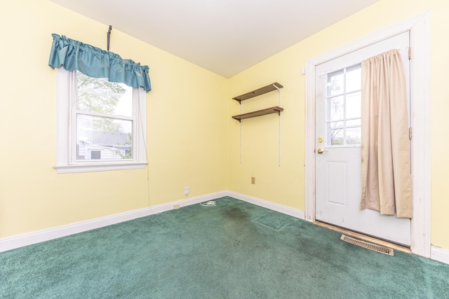 885 Hawthorne Ave, Ypsilanti, MI 48198 - empty room with dark colored carpet and baseboards
