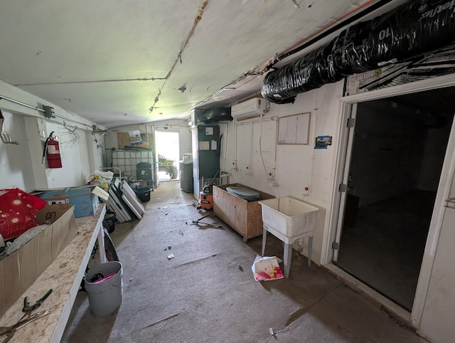 below grade area featuring a wall unit AC and heating unit