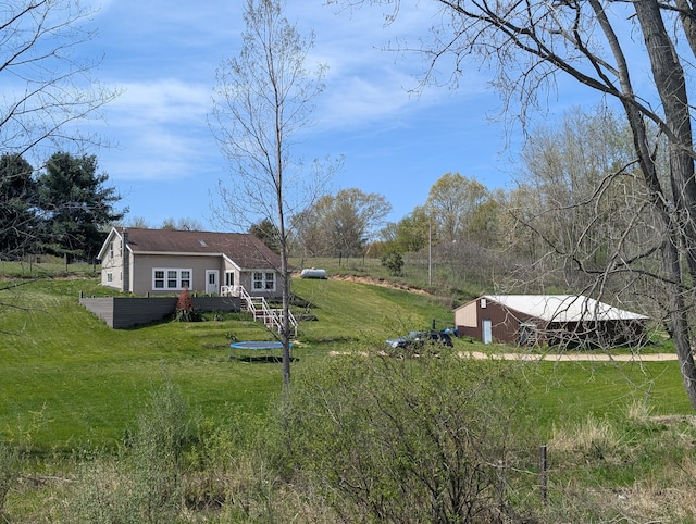 view of grassy yard featuring a wooden deck