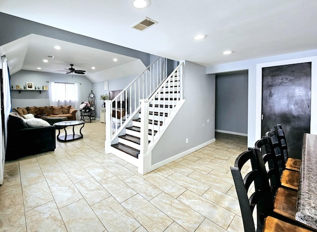 stairway featuring lofted ceiling, ceiling fan, recessed lighting, and baseboards
