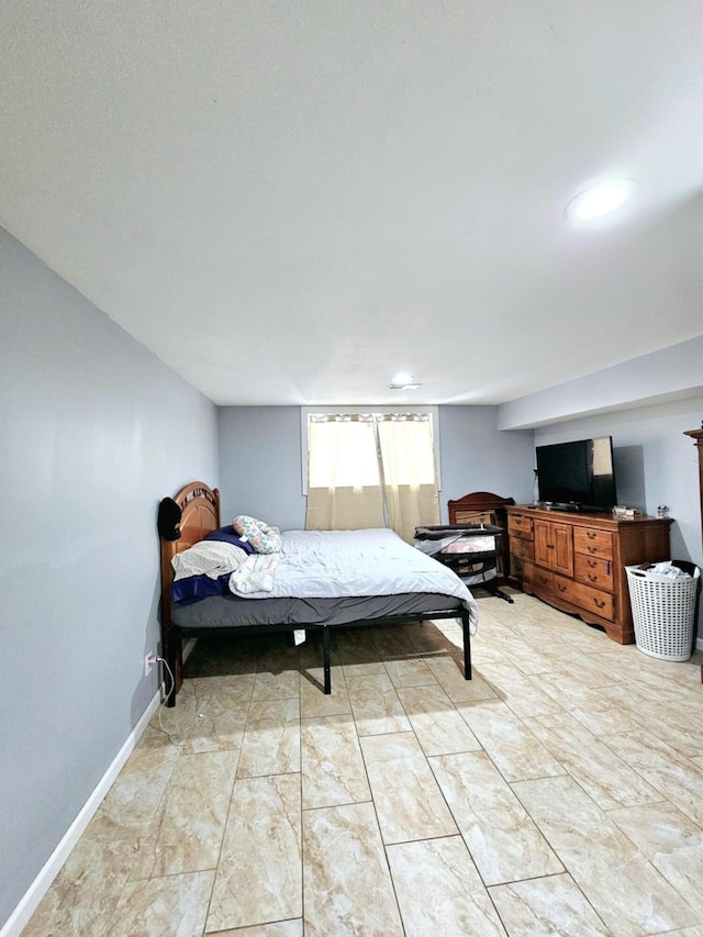bedroom featuring baseboards and recessed lighting