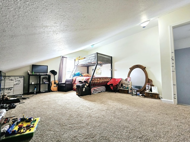 recreation room with lofted ceiling, carpet floors, and a textured ceiling