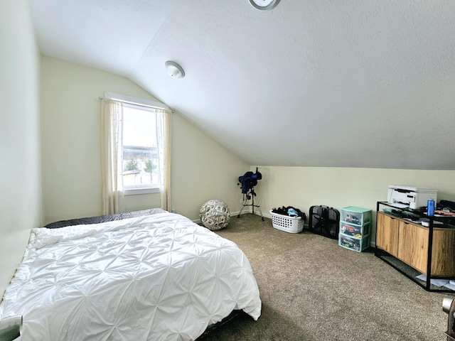 carpeted bedroom featuring lofted ceiling