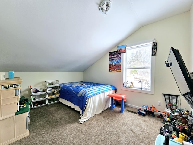 carpeted bedroom featuring vaulted ceiling and baseboards