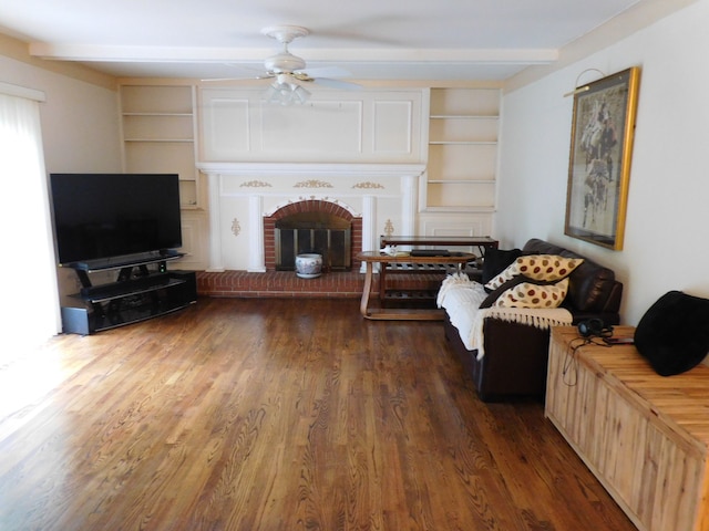 5244 Folkstone Dr, Troy, MI 48085 - living area featuring a fireplace, built in features, wood finished floors, a ceiling fan, and beamed ceiling