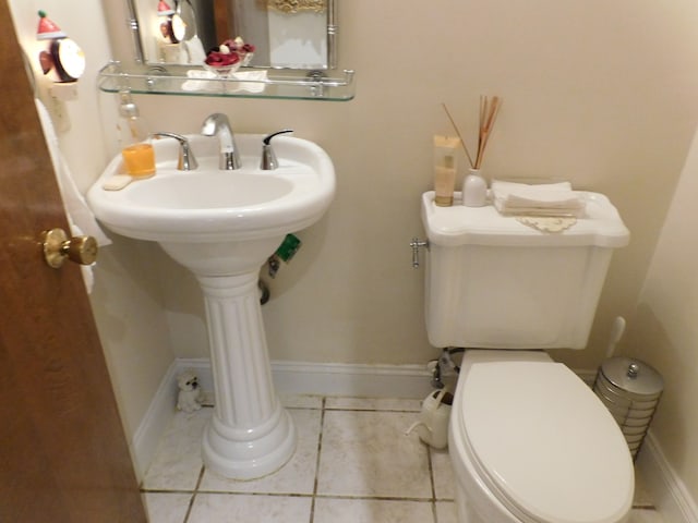 5244 Folkstone Dr, Troy, MI 48085 - half bathroom featuring toilet, tile patterned flooring, and a sink
