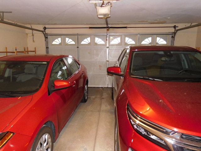 5244 Folkstone Dr, Troy, MI 48085 - garage featuring a garage door opener