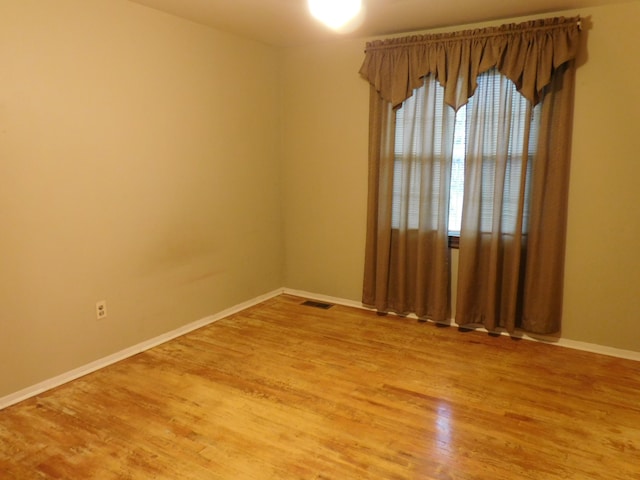 5244 Folkstone Dr, Troy, MI 48085 - spare room featuring light wood-style floors and baseboards