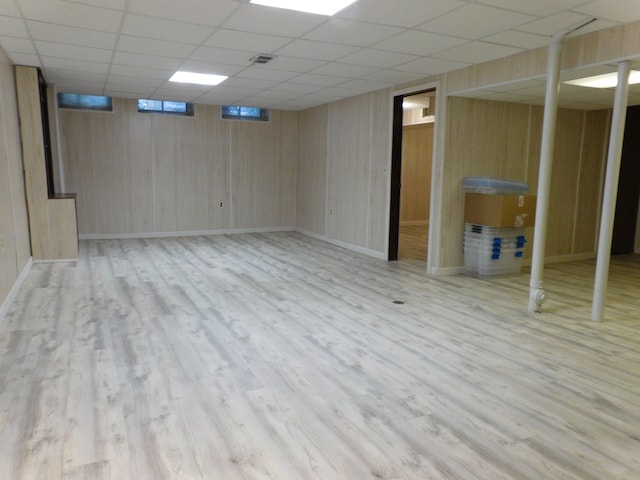 5244 Folkstone Dr, Troy, MI 48085 - finished below grade area with wood finished floors, a drop ceiling, baseboards, and wooden walls