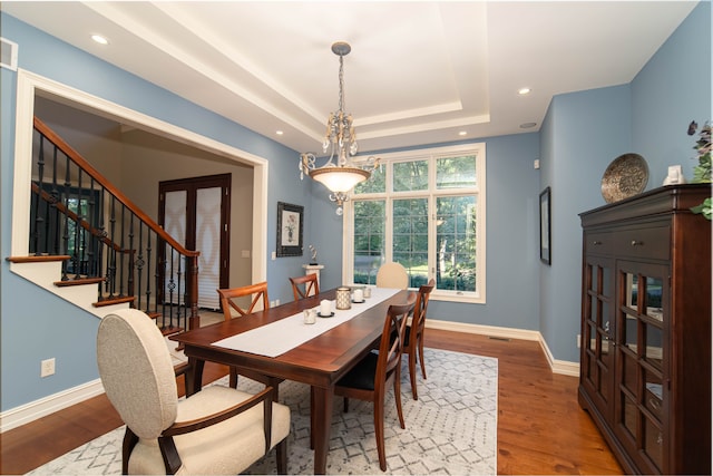 8307 Granite Ct, Dexter, MI 48130 - dining area with wood finished floors, stairway, recessed lighting, baseboards, and a raised ceiling