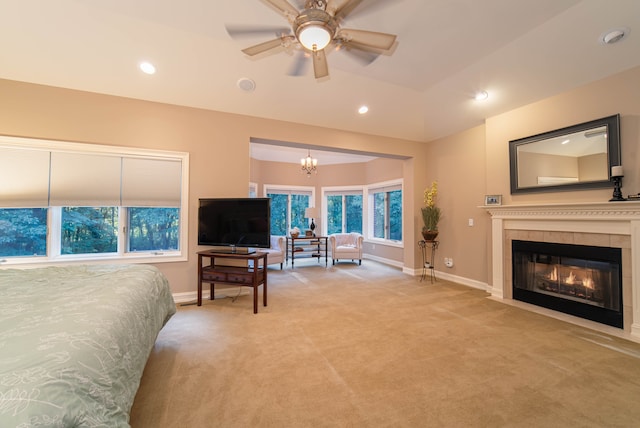 8307 Granite Ct, Dexter, MI 48130 - bedroom with baseboards, light colored carpet, a chandelier, recessed lighting, and a fireplace
