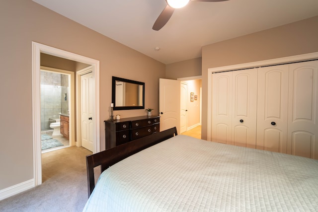 8307 Granite Ct, Dexter, MI 48130 - bedroom with carpet flooring, baseboards, a closet, ensuite bath, and ceiling fan