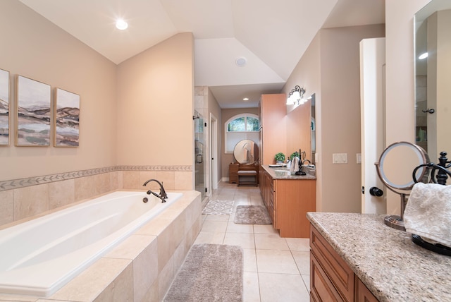 8307 Granite Ct, Dexter, MI 48130 - full bath with a stall shower, a bath, vanity, tile patterned flooring, and vaulted ceiling