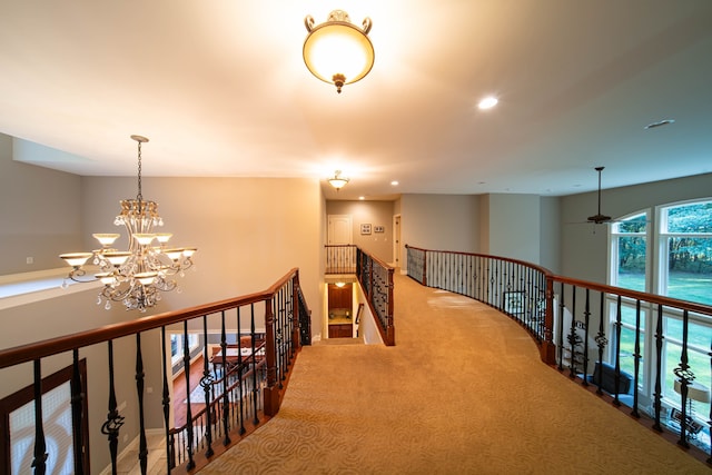 8307 Granite Ct, Dexter, MI 48130 - hallway featuring an upstairs landing, a chandelier, recessed lighting, and carpet