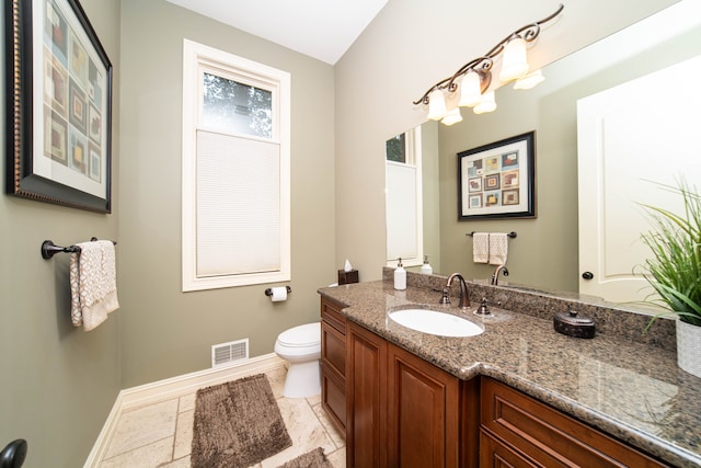 8307 Granite Ct, Dexter, MI 48130 - bathroom with baseboards, vanity, and toilet