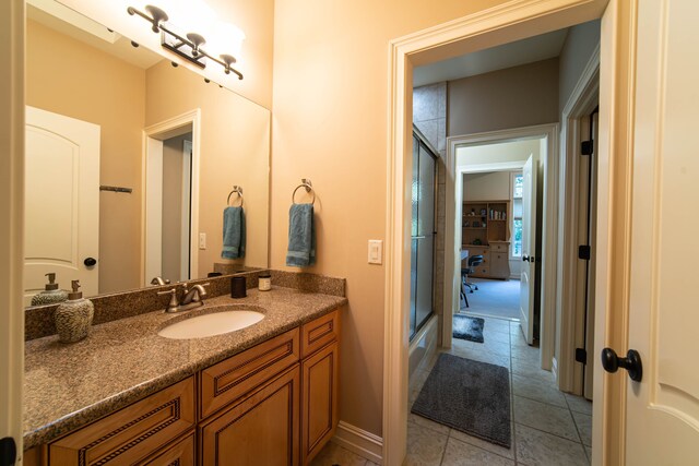 8307 Granite Ct, Dexter, MI 48130 - bathroom featuring vanity, tile patterned floors, and baseboards