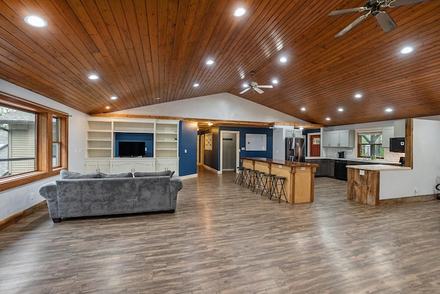 1977 E 40th St, White Cloud, MI 49349 - living area featuring a ceiling fan, lofted ceiling, wood ceiling, baseboards, and dark wood finished floors