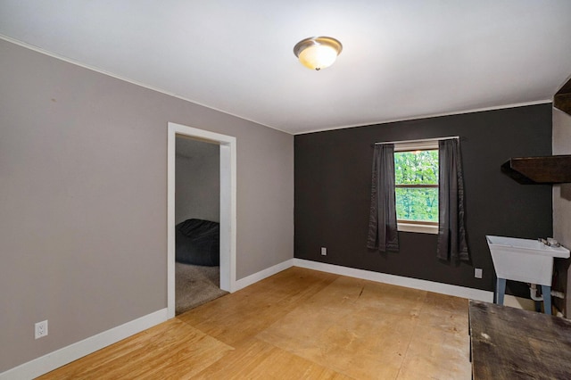 1977 E 40th St, White Cloud, MI 49349 - empty room with light wood-style floors and baseboards