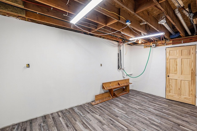 1977 E 40th St, White Cloud, MI 49349 - unfinished basement featuring wood finished floors