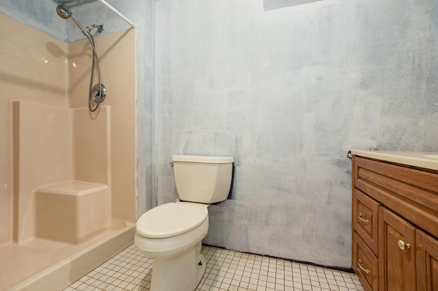 1977 E 40th St, White Cloud, MI 49349 - bathroom featuring a shower, vanity, toilet, and tile patterned flooring