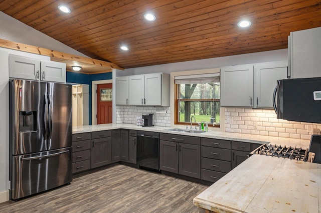 1977 E 40th St, White Cloud, MI 49349 - kitchen featuring stainless steel fridge with ice dispenser, dishwasher, black microwave, a sink, and gray cabinetry