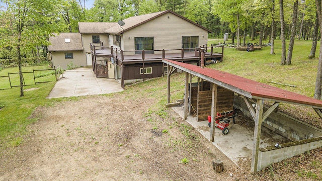 1977 E 40th St, White Cloud, MI 49349 - back of house with a deck