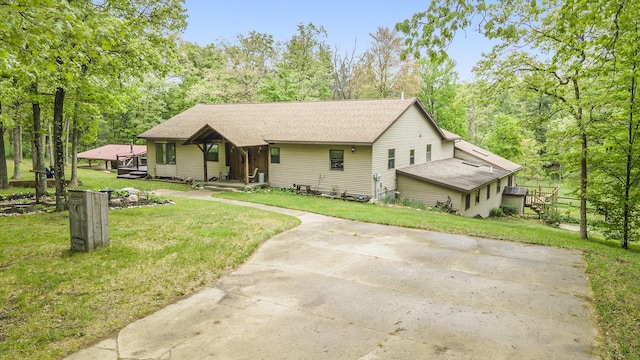 1977 E 40th St, White Cloud, MI 49349 - view of front of property with a front lawn and a shingled roof