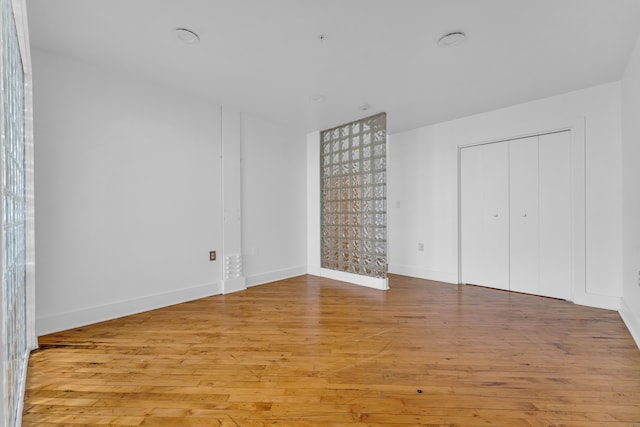 2843 E Grand Blvd Unit 9, Detroit, MI 48211 - unfurnished bedroom featuring light wood finished floors and baseboards