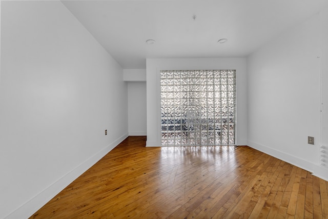 2843 E Grand Blvd Unit 9, Detroit, MI 48211 - spare room featuring hardwood / wood-style floors and baseboards