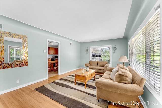 living room with wood finished floors and baseboards