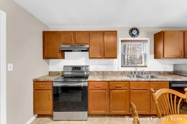kitchen featuring stainless steel electric range oven, under cabinet range hood, a sink, brown cabinets, and baseboards