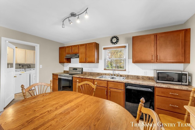kitchen with stainless steel electric stove, a sink, black dishwasher, washing machine and dryer, and under cabinet range hood
