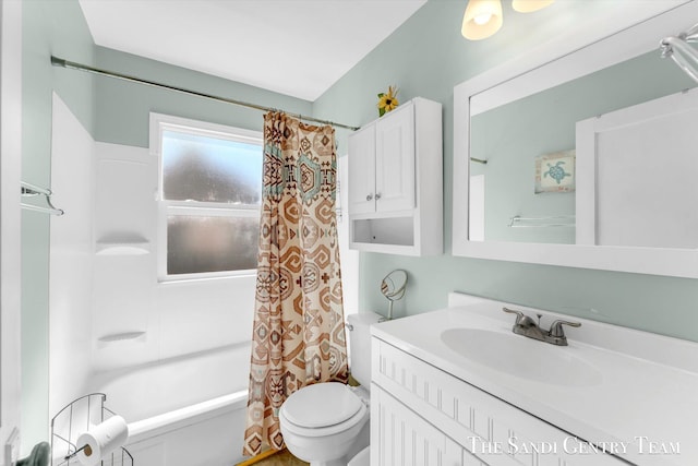 bathroom with toilet, vanity, and shower / bath combo with shower curtain