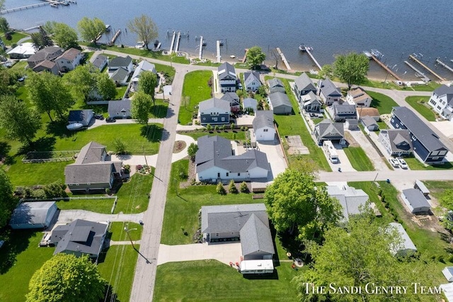 aerial view of residential area with a large body of water
