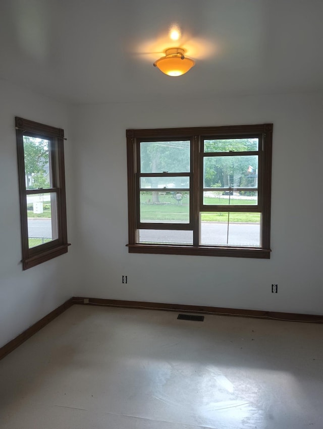 318 W King St, Owosso, MI 48867 - empty room featuring baseboards