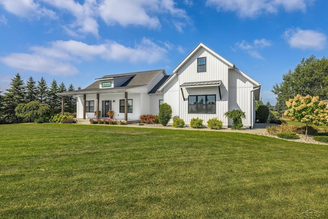 5353 N Graham Rd, Freeland, MI 48623 - modern inspired farmhouse featuring a porch, board and batten siding, and a front yard