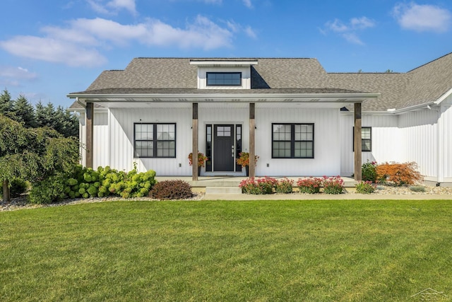 5353 N Graham Rd, Freeland, MI 48623 - modern farmhouse with a porch, a front lawn, roof with shingles, and board and batten siding