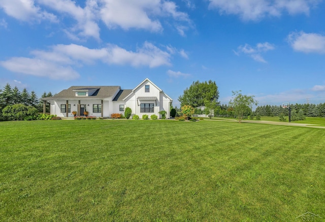 5353 N Graham Rd, Freeland, MI 48623 - view of front of home with a front yard, covered porch, and board and batten siding