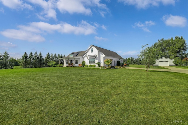 5353 N Graham Rd, Freeland, MI 48623 - modern farmhouse style home with a front yard, a detached garage, and solar panels