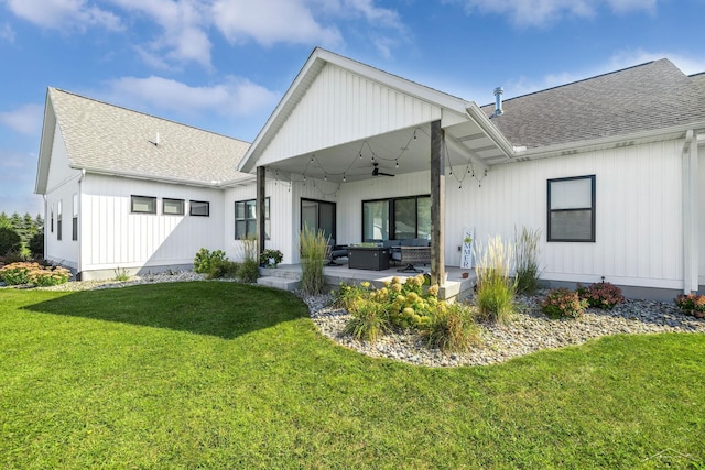 5353 N Graham Rd, Freeland, MI 48623 - rear view of house featuring roof with shingles, a ceiling fan, a yard, and a patio