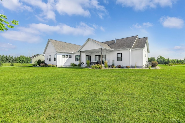 5353 N Graham Rd, Freeland, MI 48623 - rear view of property with ceiling fan, a yard, a patio, and roof with shingles