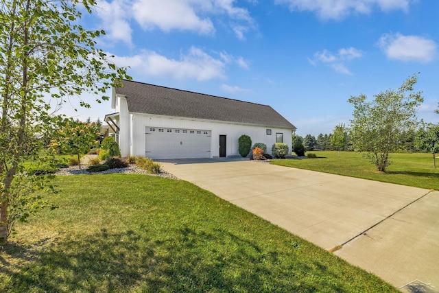5353 N Graham Rd, Freeland, MI 48623 - view of home's exterior featuring concrete driveway, an attached garage, a yard, and a shingled roof