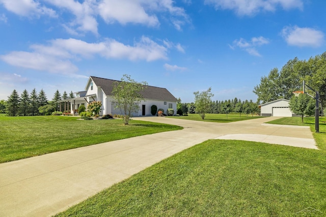 5353 N Graham Rd, Freeland, MI 48623 - surrounding community featuring a lawn, a detached garage, and an outbuilding