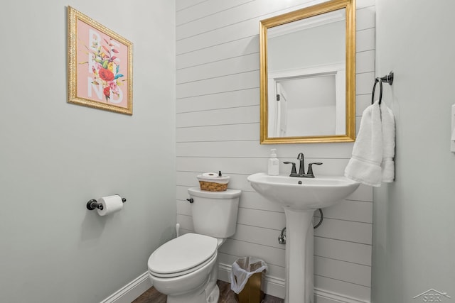 5353 N Graham Rd, Freeland, MI 48623 - half bathroom featuring toilet, wood finished floors, and baseboards