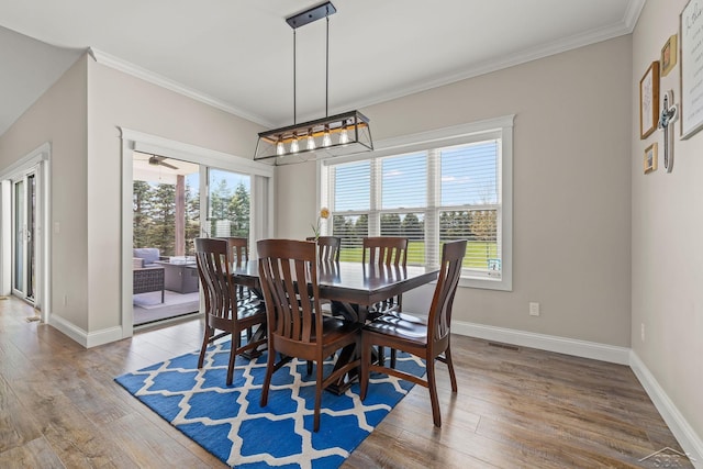5353 N Graham Rd, Freeland, MI 48623 - dining space with wood finished floors, crown molding, and baseboards