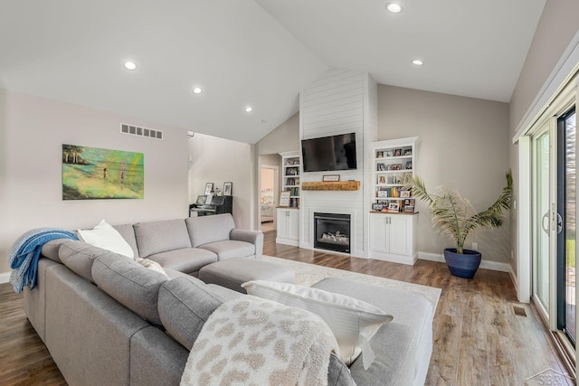 5353 N Graham Rd, Freeland, MI 48623 - living room with a fireplace, lofted ceiling, wood finished floors, baseboards, and recessed lighting