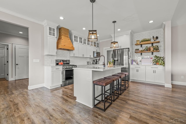 5353 N Graham Rd, Freeland, MI 48623 - kitchen with stainless steel appliances, custom exhaust hood, open shelves, tasteful backsplash, and a kitchen breakfast bar