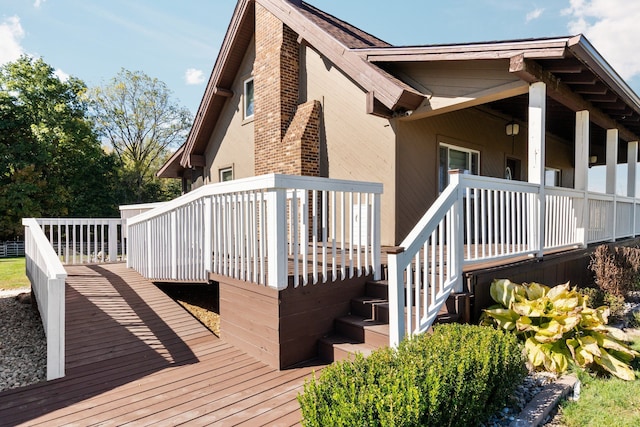 view of side of property featuring a wooden deck